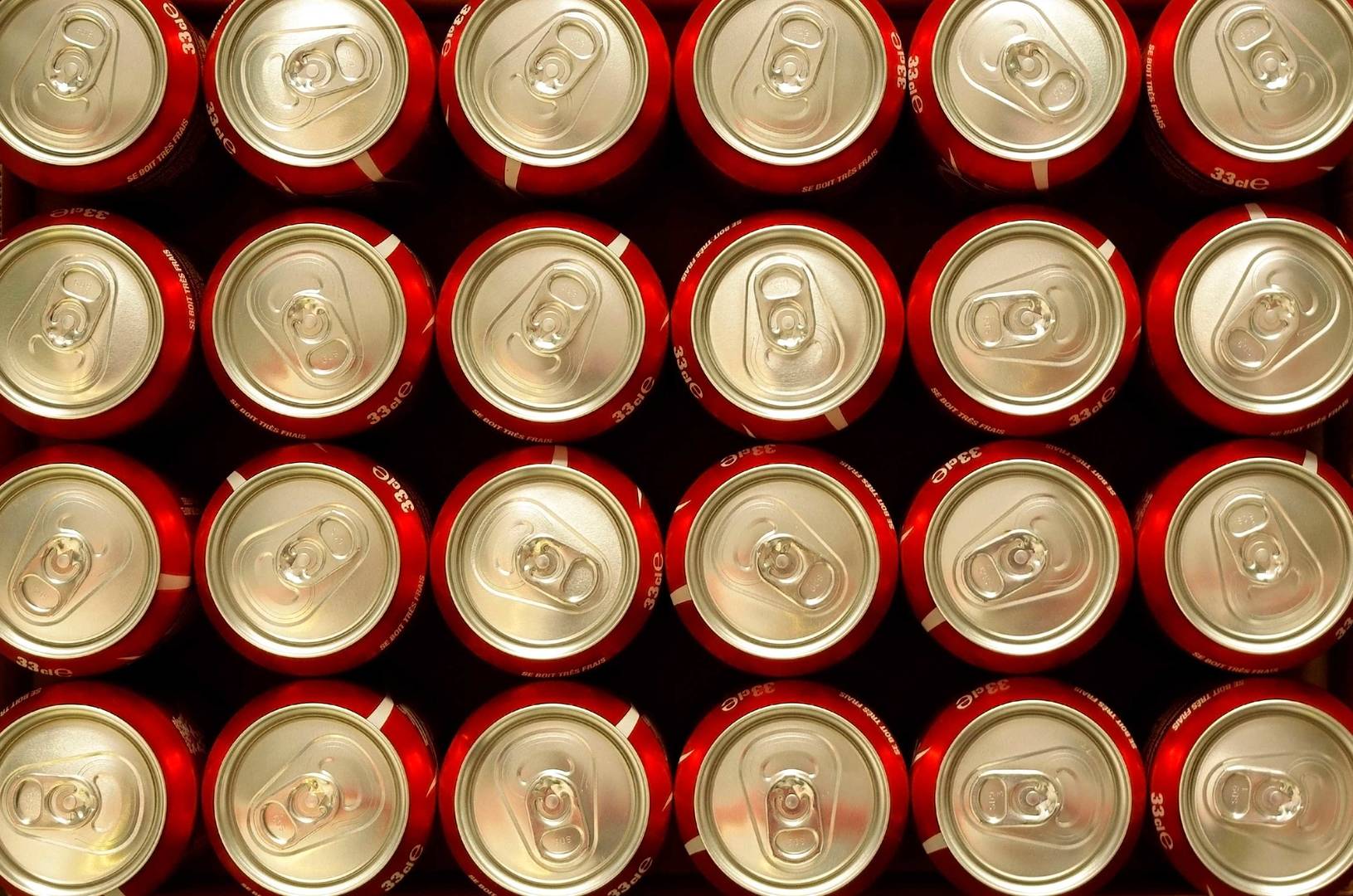 Cans of Cola stacked up