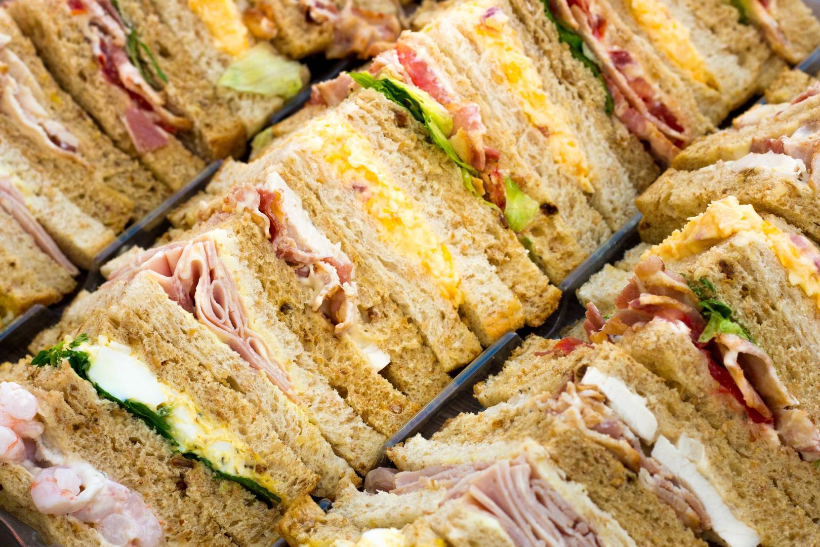 rows of various sandwiches displayed