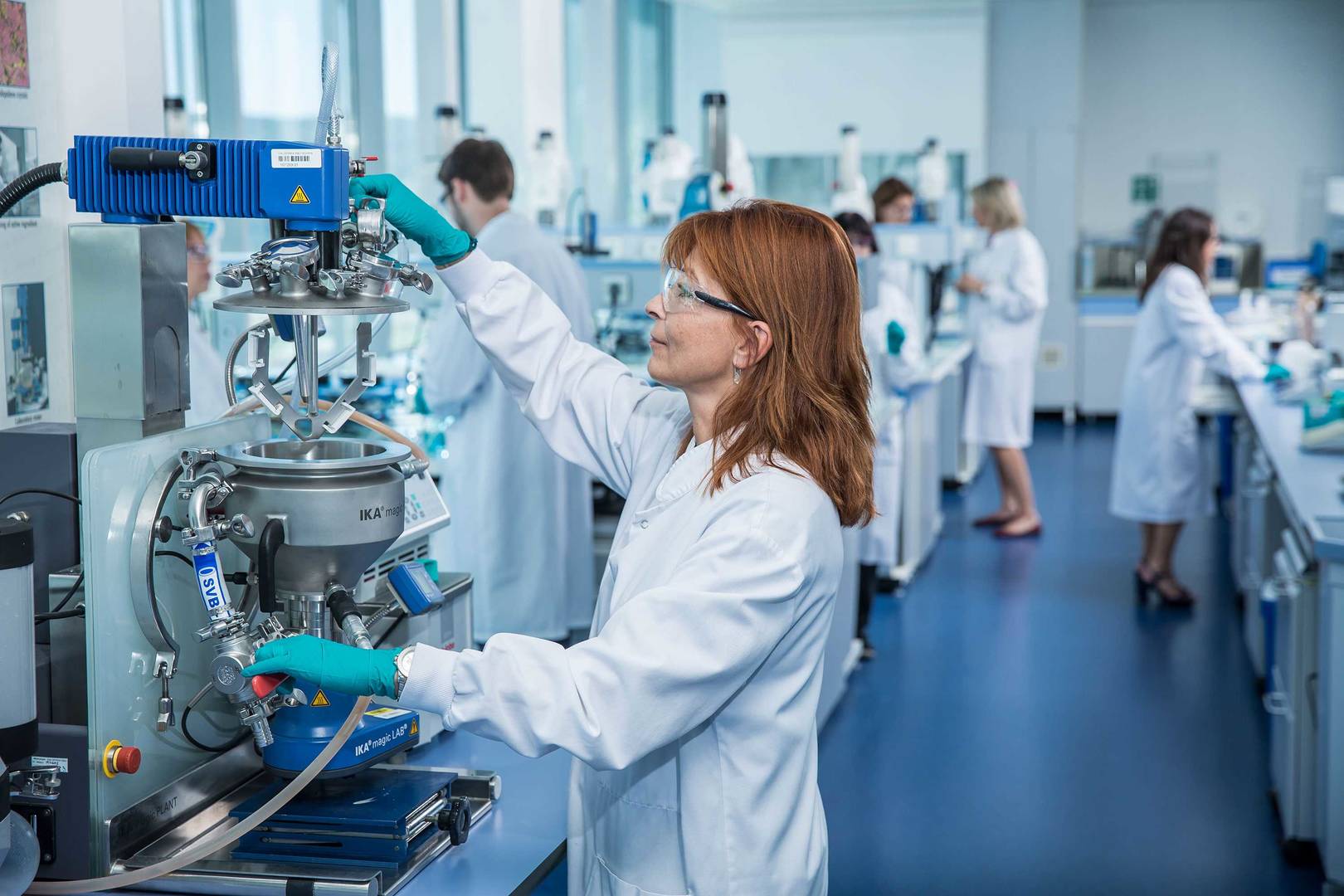 Female scientist working with lab equipment