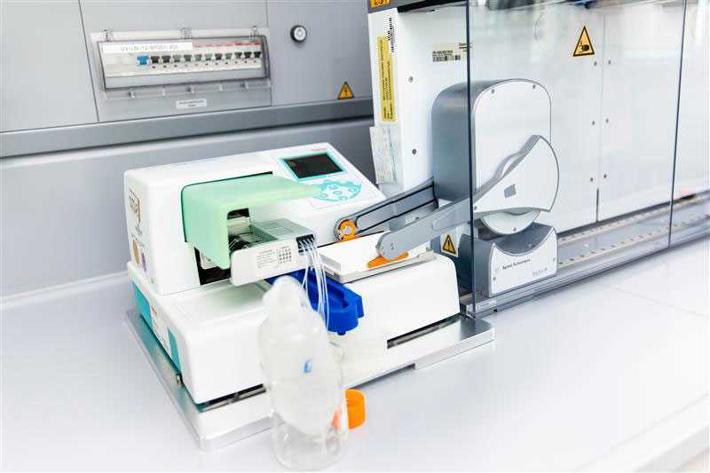 Laboratory automation system with a pipetting device and reagent bottles