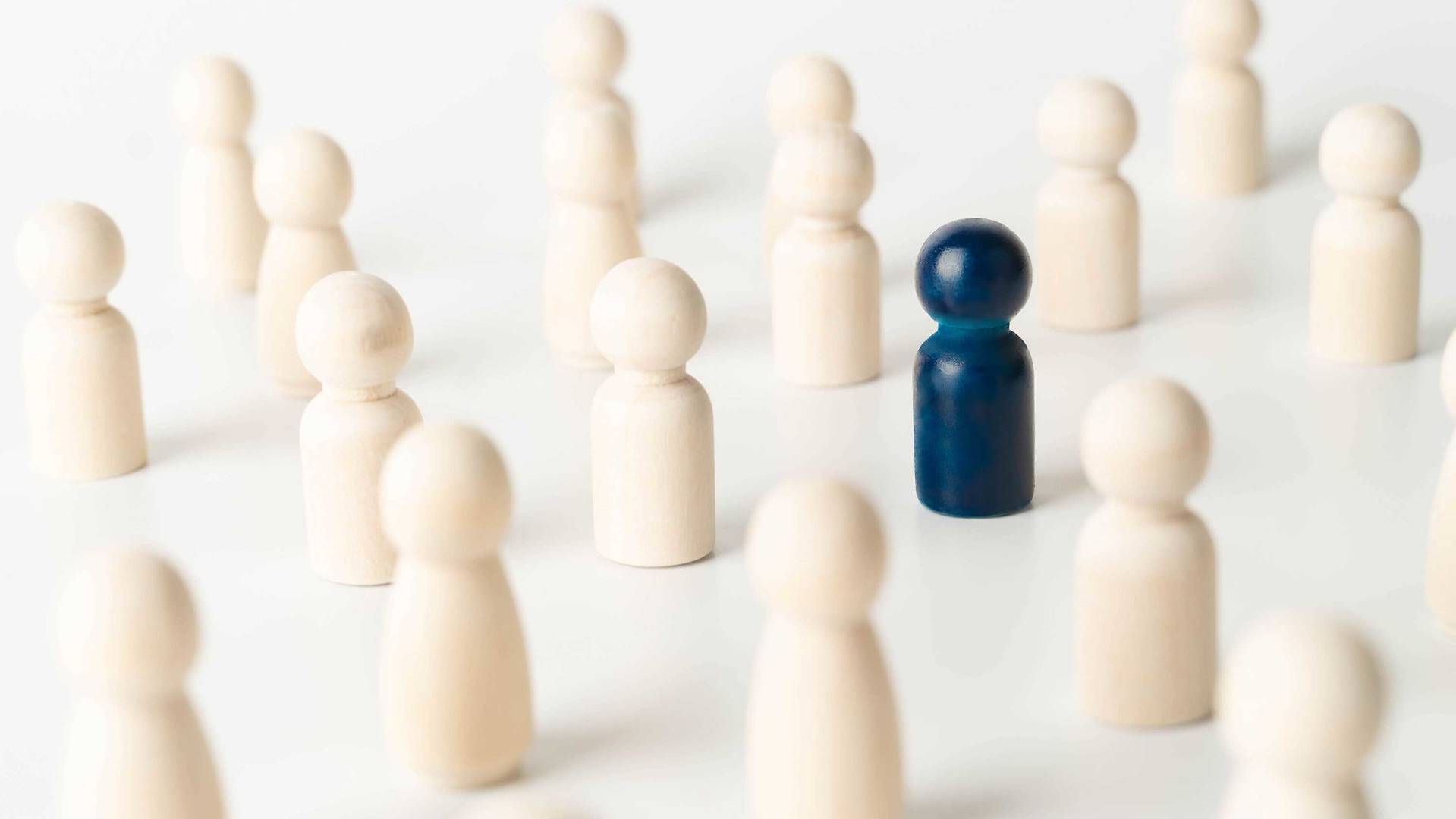 Blue figure in the middle of white figures, representing an outlier