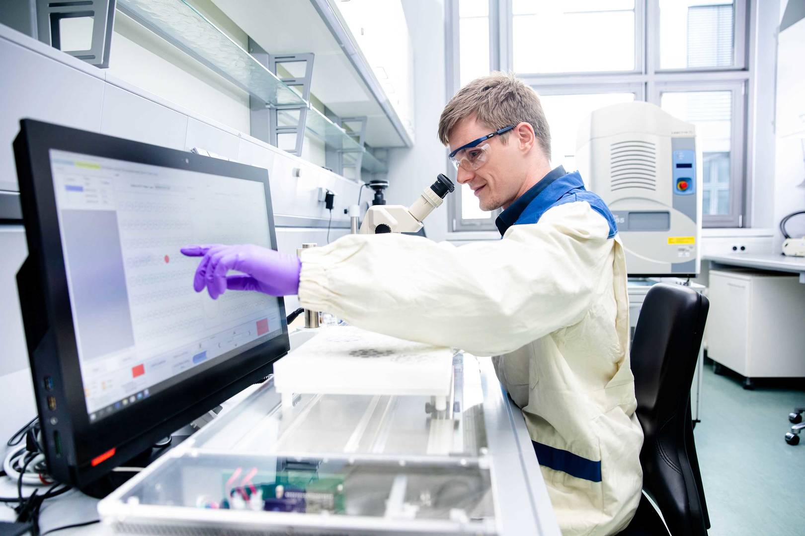 A scientist harvesting crystals for X-ray fragment screening campaign