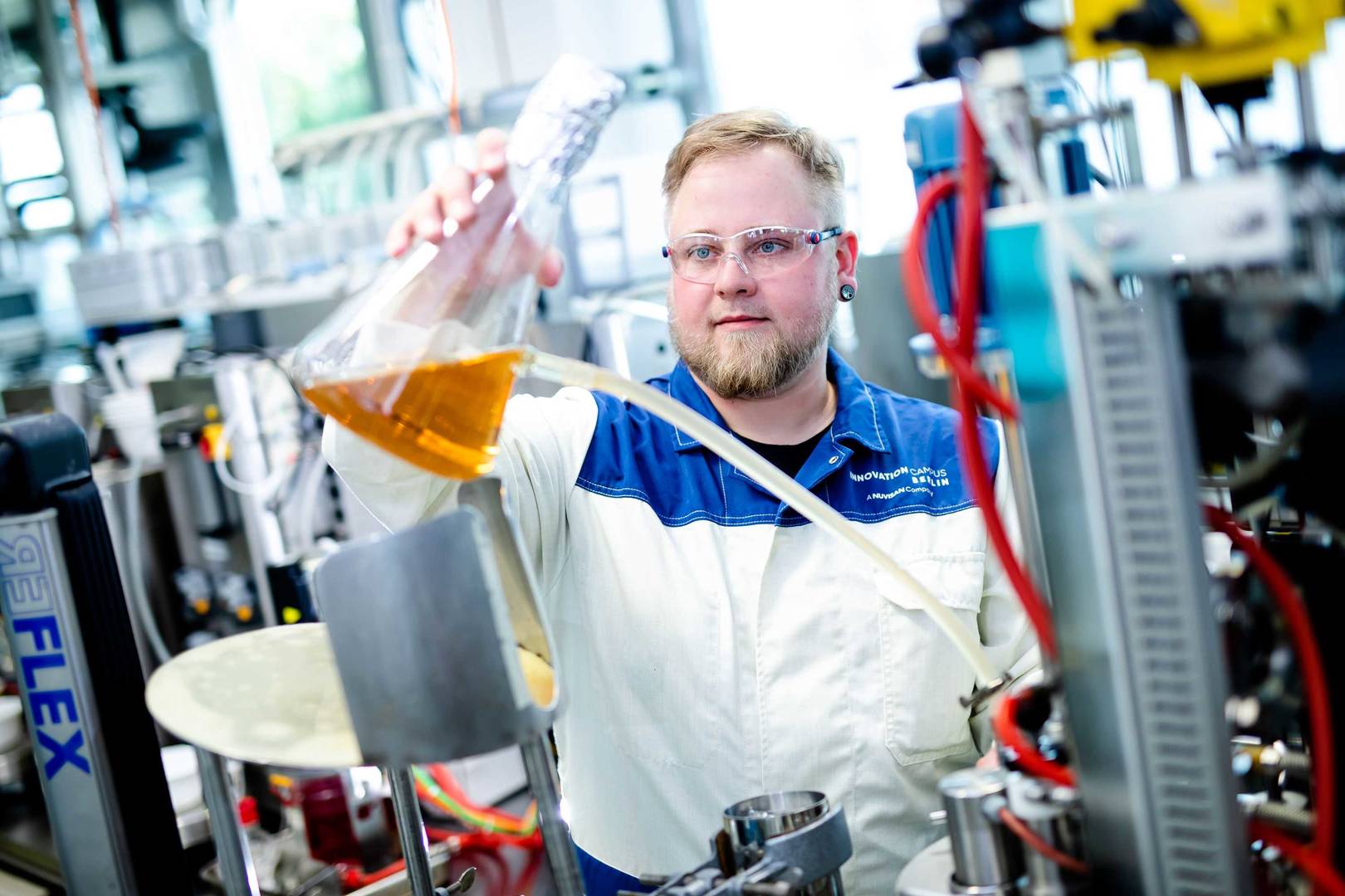 Scientist inoculating a biofermenter