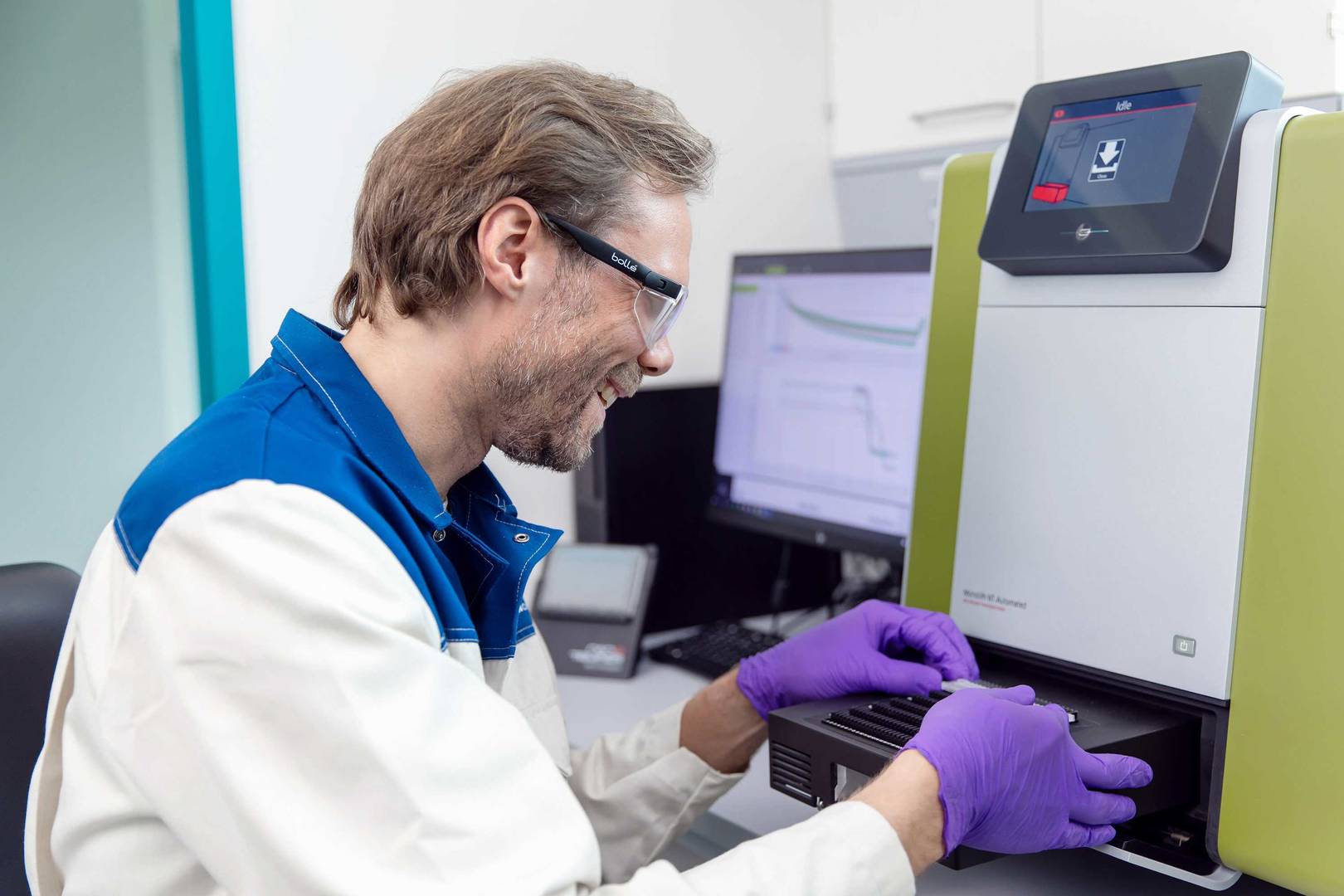 Laboratory researcher preparing capillaries for measurements on an MST instrument