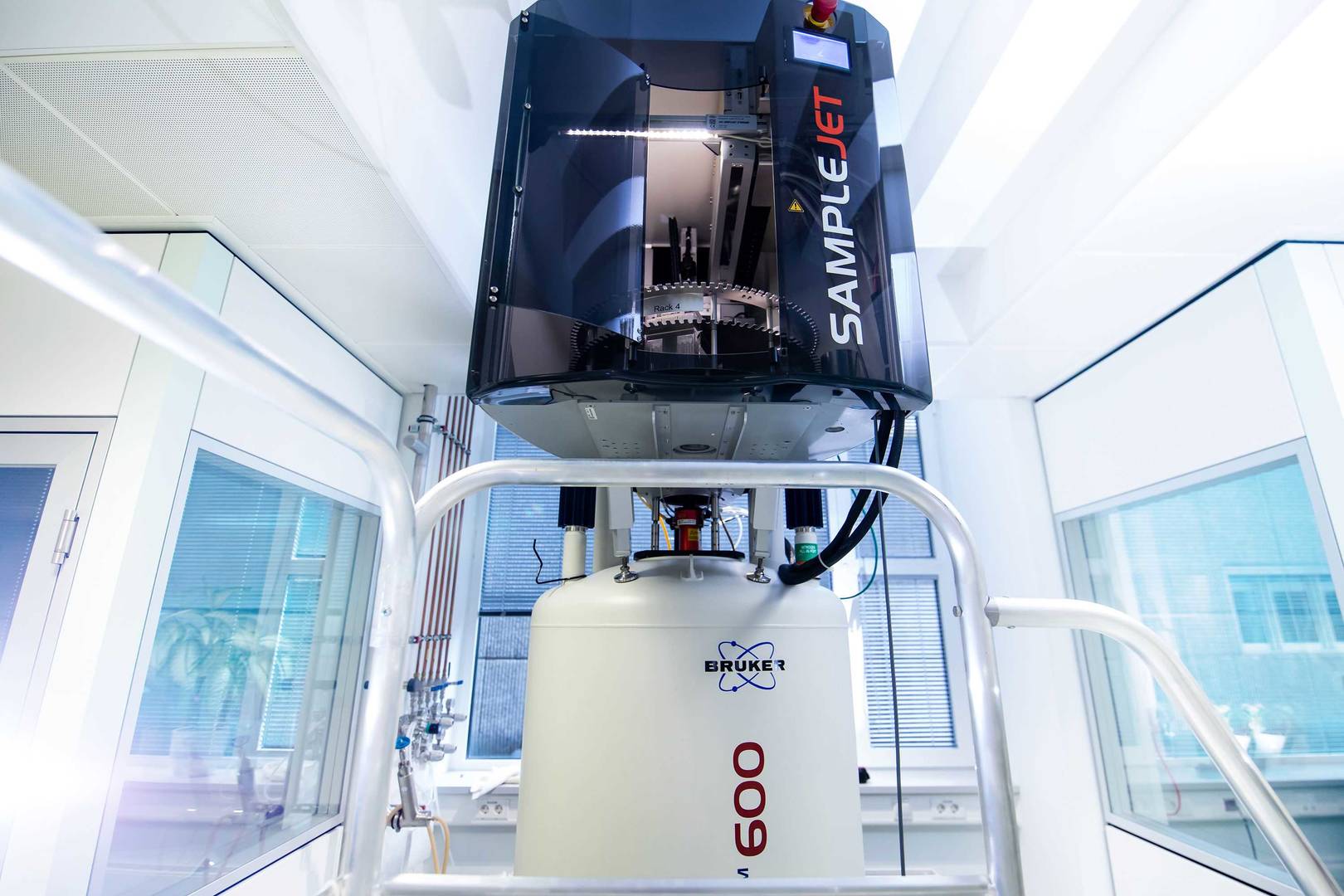 High-throughput NMR measurements using a SampleJet